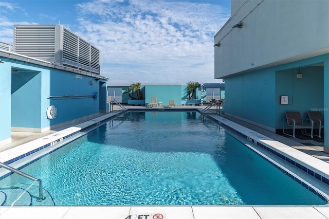 view of pool featuring a patio