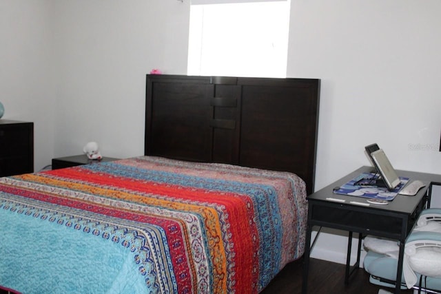 bedroom featuring dark hardwood / wood-style floors