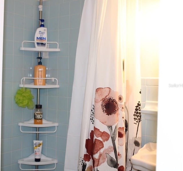 bathroom with a shower with shower curtain