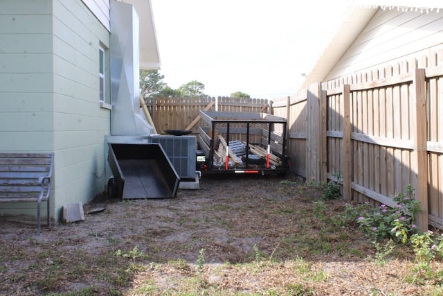 view of yard with central air condition unit