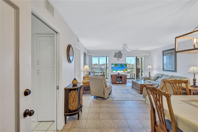 living room with ceiling fan