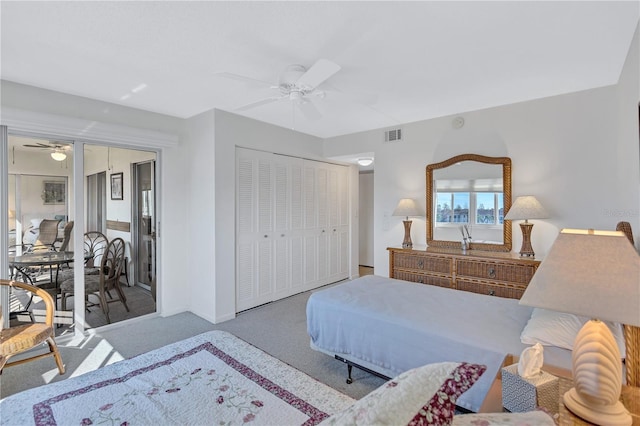 bedroom featuring ceiling fan, a closet, and light colored carpet