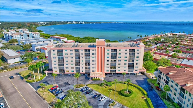 birds eye view of property with a water view