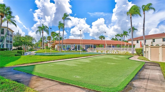 view of home's community with a yard