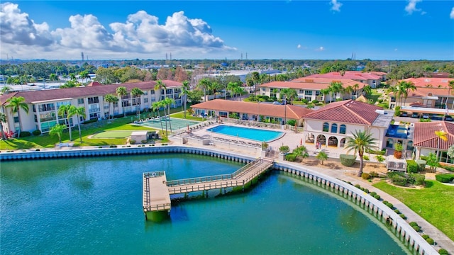 view of swimming pool featuring a water view