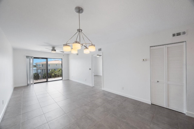 8701 Blind Pass Rd Unit 306B, St Pete Beach, FL 33706 - unfurnished living room featuring a chandelier, tile patterned flooring, and ceiling fan