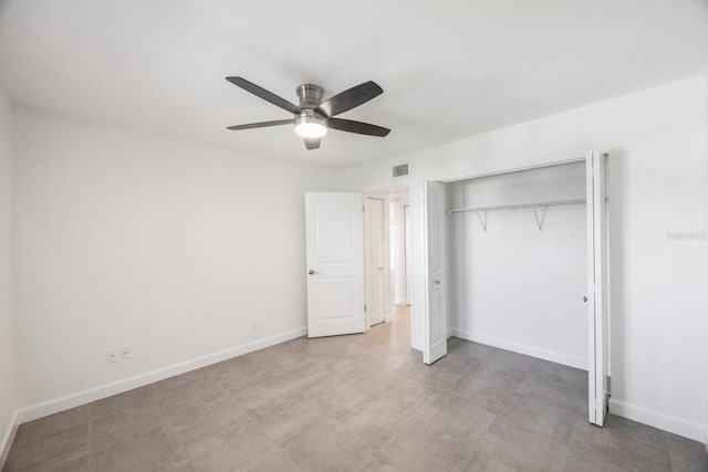 8701 Blind Pass Rd Unit 306B, St Pete Beach, FL 33706 - unfurnished bedroom with a closet, a ceiling fan, and light floors