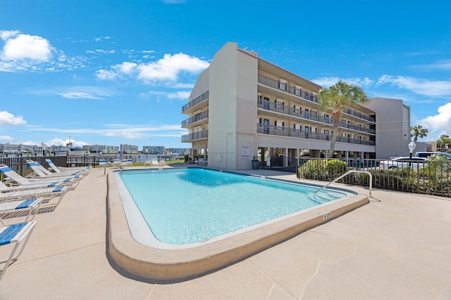 view of swimming pool with a patio area