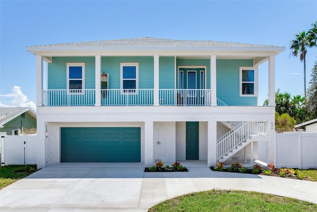 view of front of home featuring a porch and a garage