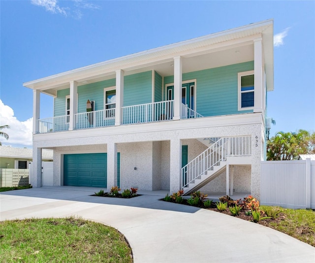 view of front facade featuring a porch and a garage