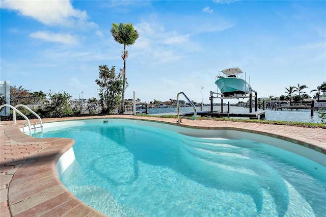 view of pool with a water view