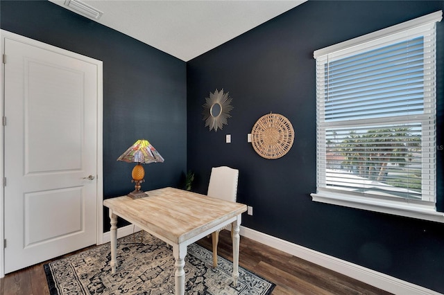 office with dark hardwood / wood-style flooring