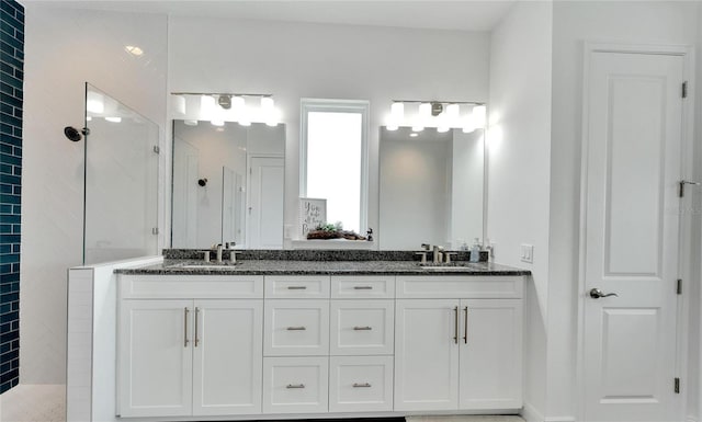 bathroom featuring vanity and walk in shower