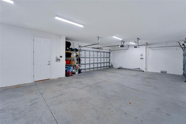 garage featuring a garage door opener