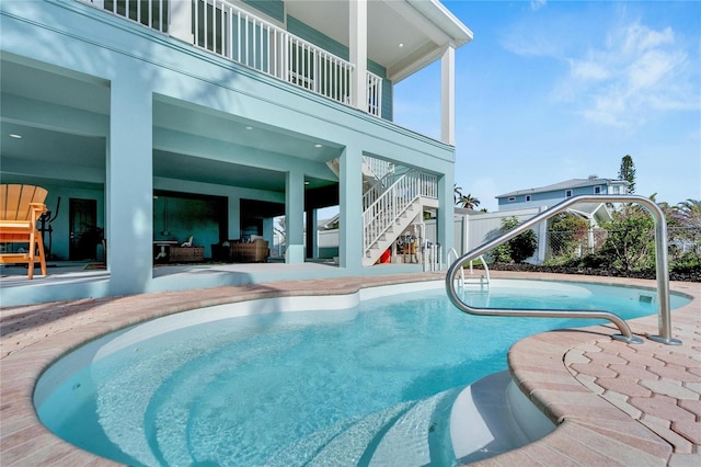 view of swimming pool featuring outdoor lounge area and a patio area