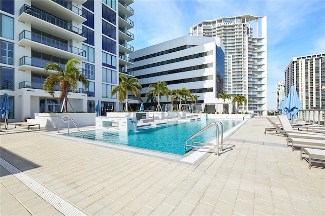 view of swimming pool featuring a patio area