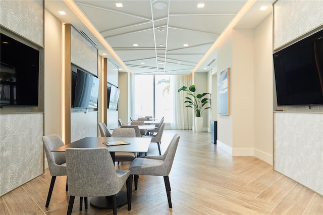 dining space with a chandelier and floor to ceiling windows