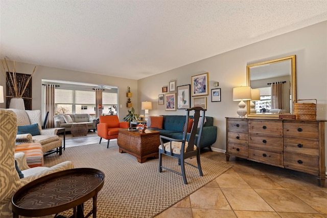 living room featuring light tile patterned floors and a textured ceiling