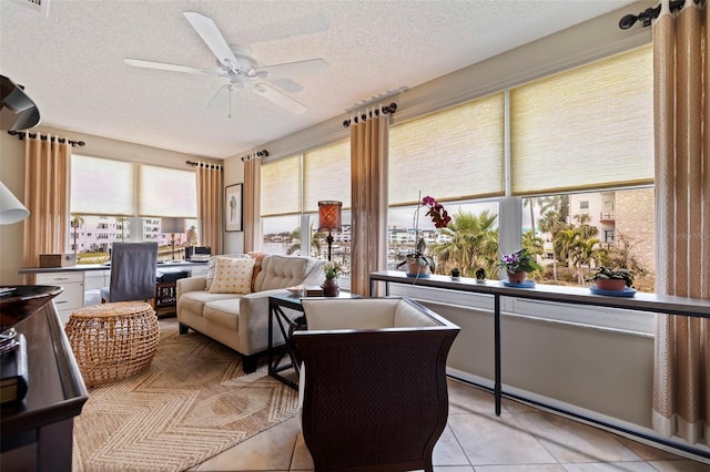 sunroom / solarium with ceiling fan