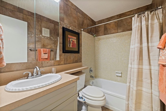 full bathroom with toilet, vanity, and shower / bath combo with shower curtain