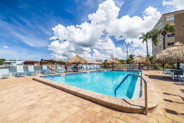 view of swimming pool featuring a gazebo and a patio