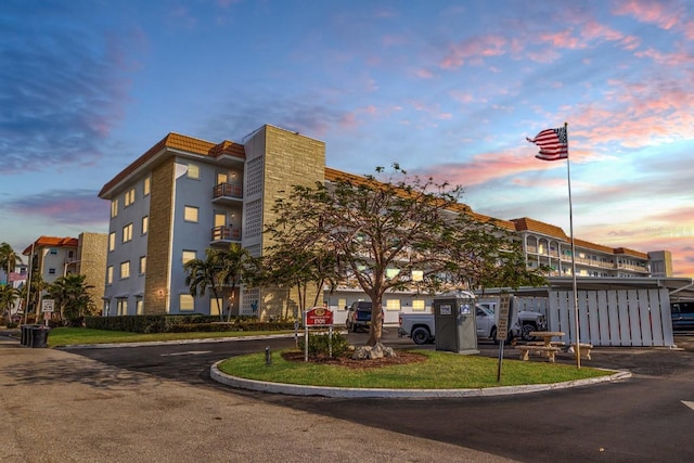 view of outdoor building at dusk