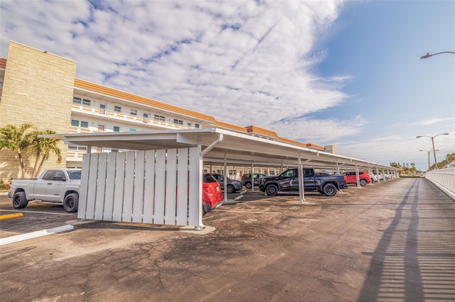 view of parking / parking lot with a carport