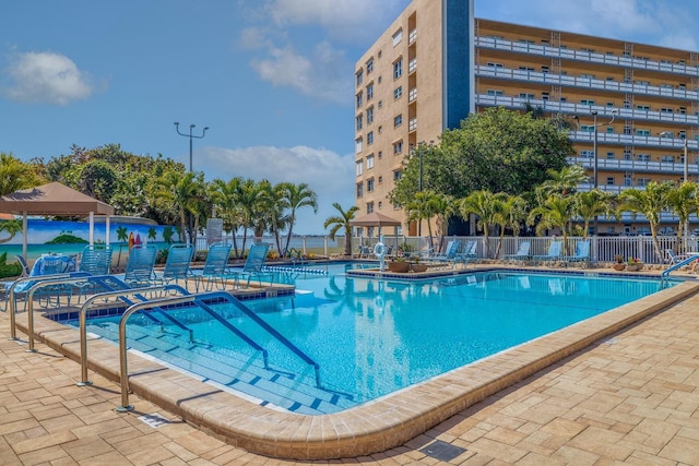 view of swimming pool featuring a patio area and a gazebo