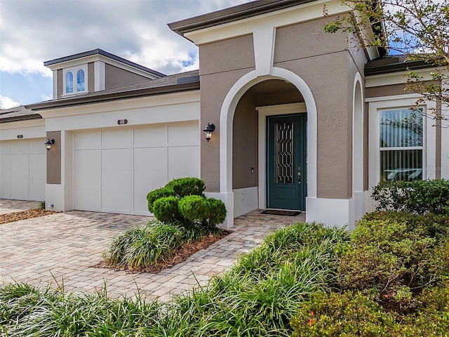 doorway to property featuring a garage