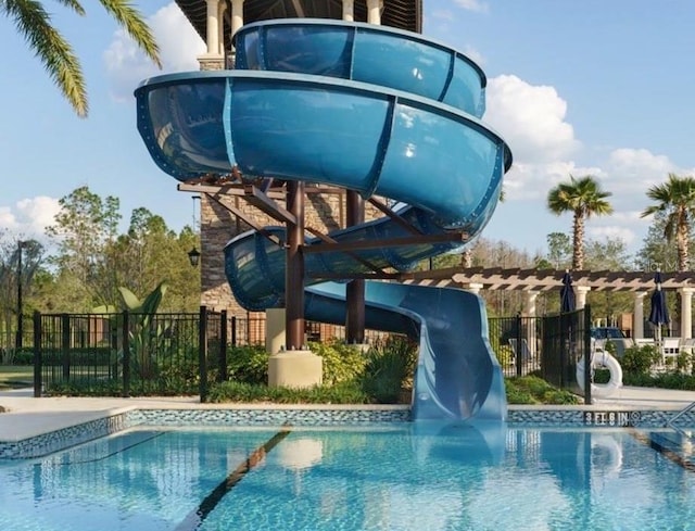 view of pool with a water slide