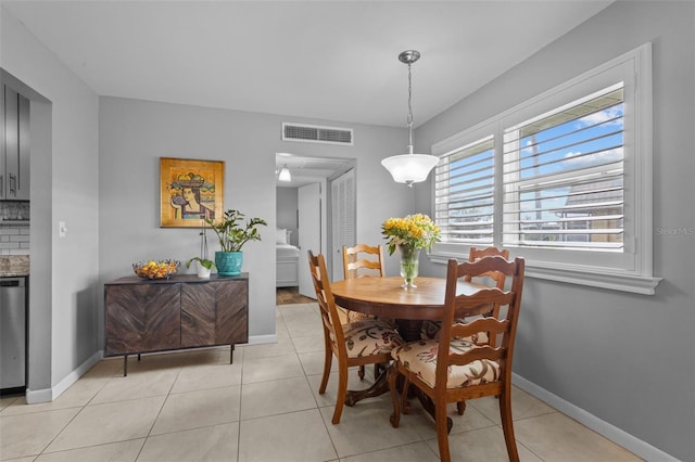 dining space with light tile patterned floors