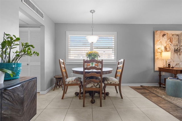 dining area featuring light tile patterned floors