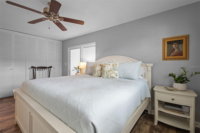 bedroom with a closet, ceiling fan, and dark hardwood / wood-style flooring