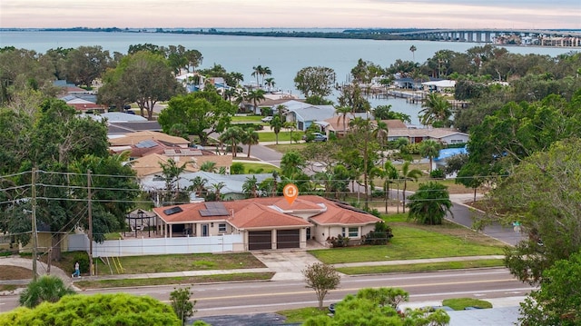 aerial view at dusk with a water view