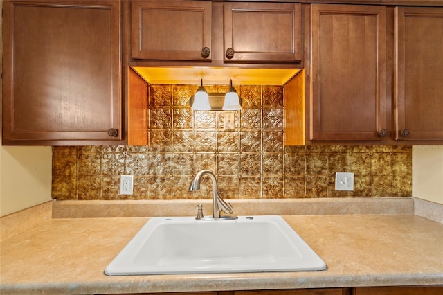 kitchen featuring backsplash and sink