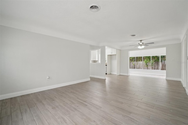 unfurnished living room featuring light hardwood / wood-style floors and ceiling fan