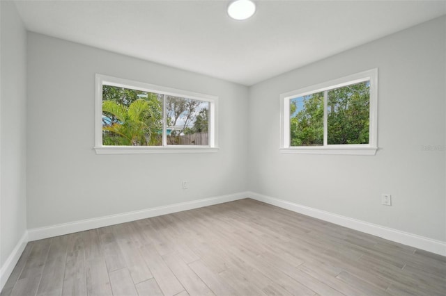 spare room featuring light hardwood / wood-style flooring