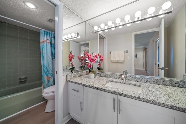 full bathroom featuring vanity, hardwood / wood-style floors, shower / bathtub combination with curtain, and toilet