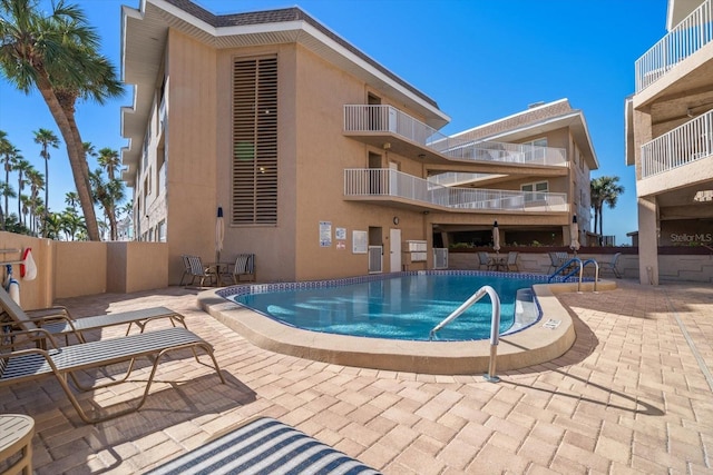 view of pool featuring a patio