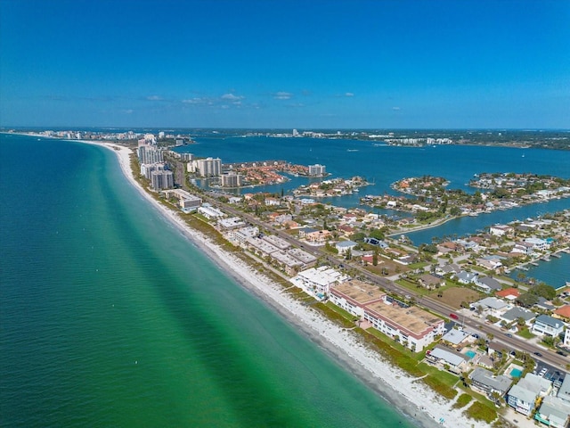 bird's eye view featuring a water view and a view of the beach