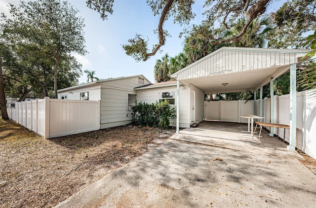 view of home's exterior featuring a carport