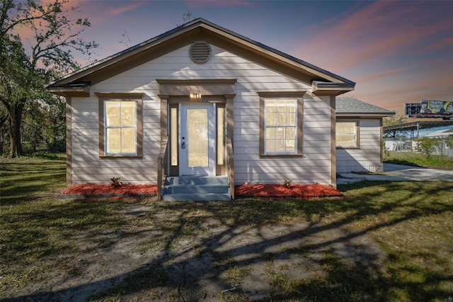 view of front of property with a yard