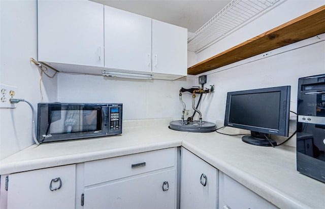 kitchen with white cabinetry