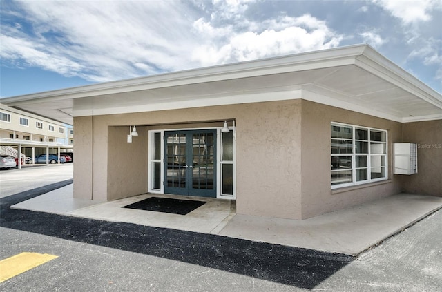 property entrance featuring french doors