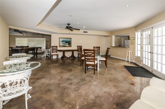 dining area featuring french doors and ceiling fan