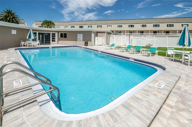 view of swimming pool featuring a patio area