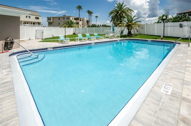 view of swimming pool with a patio