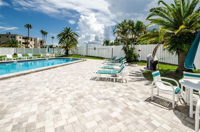 view of swimming pool with a patio