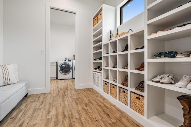 interior space featuring independent washer and dryer and light wood-type flooring