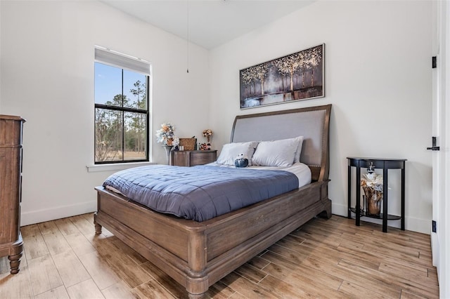 bedroom with light hardwood / wood-style flooring